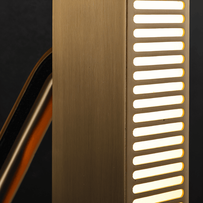 Modern Munira Wall Lamp by Residence Supply featuring a sleek design and warm lighting, mounted on a neutral wall.