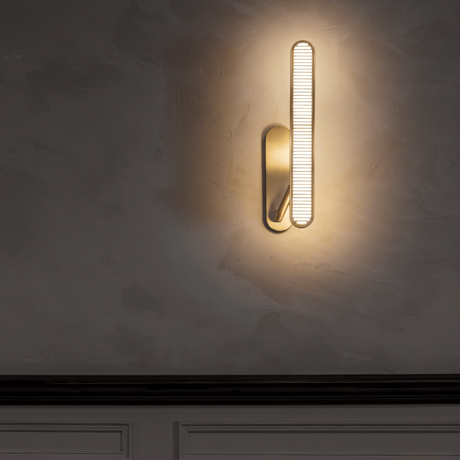 Munira wall lamp by Residence Supply featuring a sleek metal design and soft ambient lighting for modern interior decor.