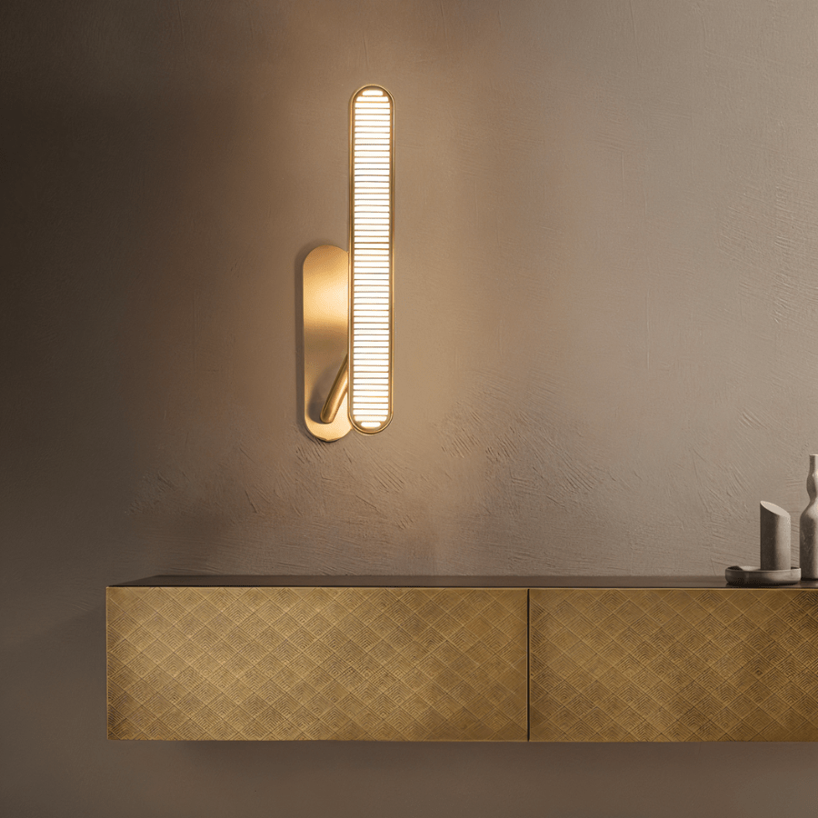 Modern Munira Wall Lamp by Residence Supply featuring a sleek metal design and soft ambient lighting.