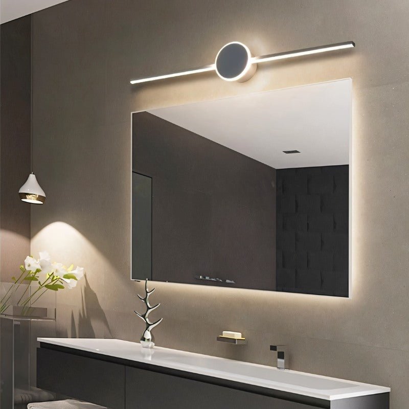 Modern Mura Wall Lamp by Residence Supply with sleek design and warm lighting, mounted on a wall in a contemporary interior.