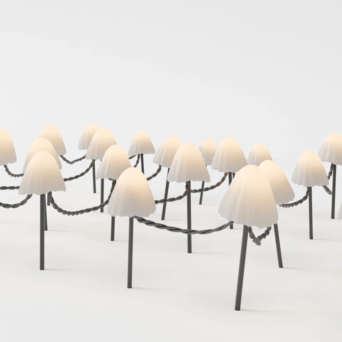 Mycena Outdoor Garden Lamp by Residence Supply illuminating a garden space with warm LED light in a stylish design