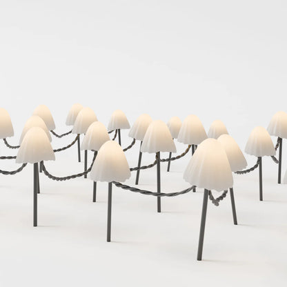 Mycena Outdoor Garden Lamp by Residence Supply illuminating a garden space with warm LED light in a stylish design