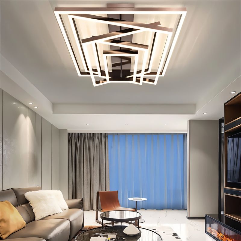 Naia Ceiling Light by Residence Supply featuring a modern design with a sleek metal finish and glass shade hanging from the ceiling.