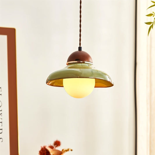 Ceramic and wood Nalt pendant light by Residence Supply with vintage-style design and illuminated interior.