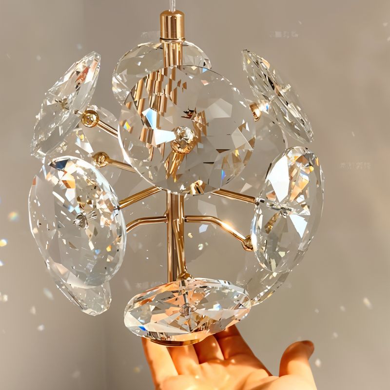 Naqi Crystal Wall Lamp by Residence Supply featuring a sleek design with crystal accents and metallic finish.