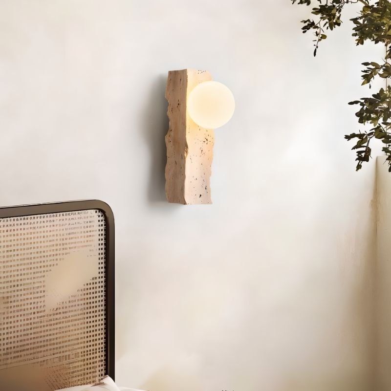 Narvi Wall Lamp by Residence Supply mounted in a bedroom setting, featuring a sleek, modern design with warm lighting.