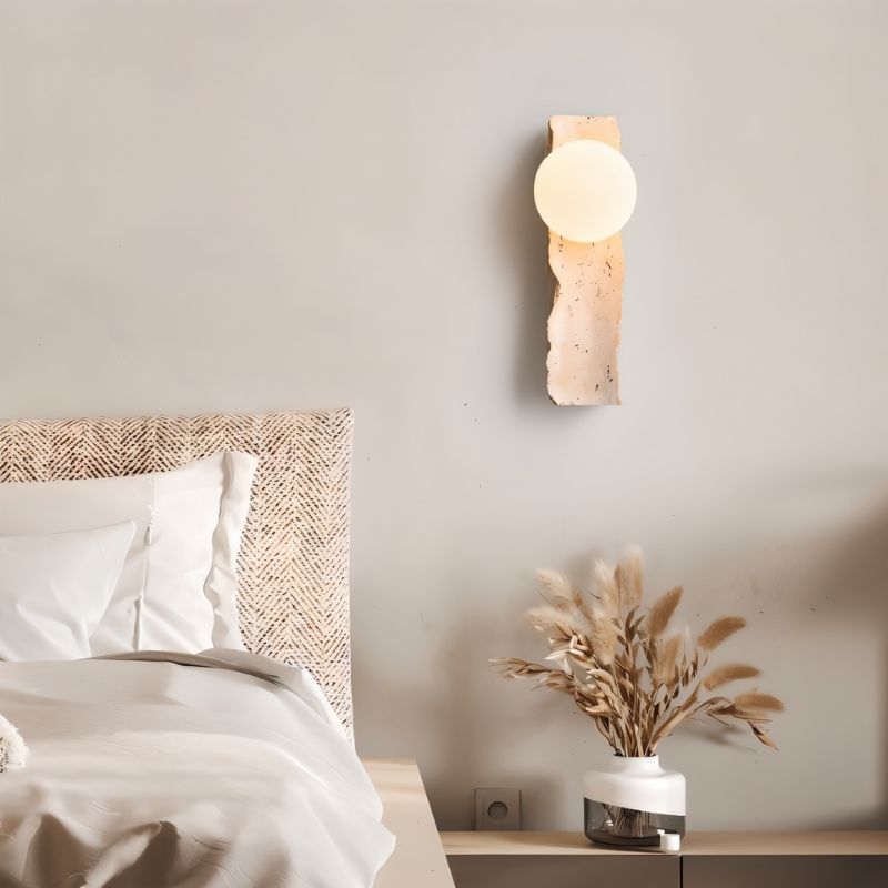 Narvi wall lamp by Residence Supply mounted on bedroom wall with sleek modern design and warm lighting.
