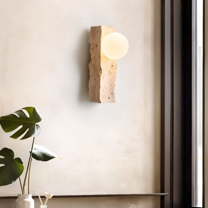 Narvi Wall Lamp by Residence Supply featuring natural travertine stone and a glass shade, wall-mounted lighting fixture.