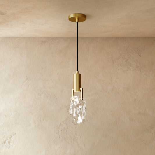 Natalia Pendant Light by Residence Supply hanging from ceiling with a sleek modern design and metal finish.