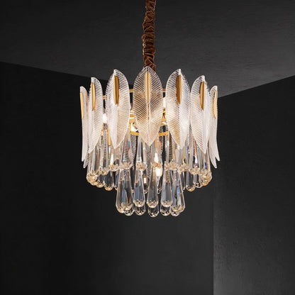 Nehora round crystal chandelier with multiple hanging crystals and a polished metal frame, designed for elegant interior lighting.