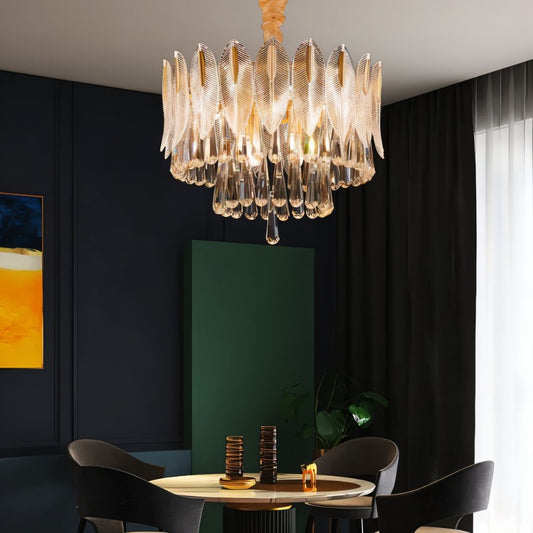 Nehora round crystal chandelier with multiple hanging crystals and a sleek metal frame, designed for elegant lighting.