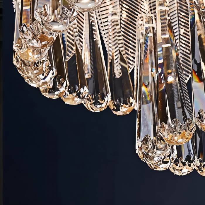 Round crystal chandelier by Nehora featuring multiple sparkling crystals and a sleek metal frame, ideal for elegant interiors.