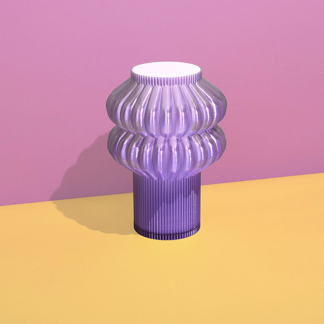 Purple Oppi Table Lamp by Terra Labs featuring a modern, minimalist design with a smooth, rounded base and soft lighting.