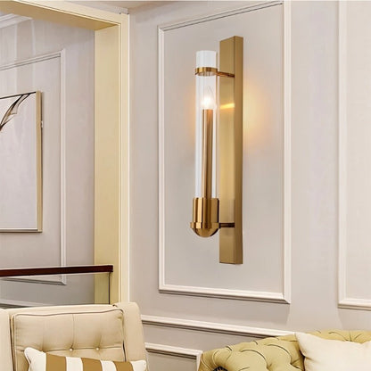Modern brass Nexovia wall lamp with glass shade, ideal for living room decor by Residence Supply.