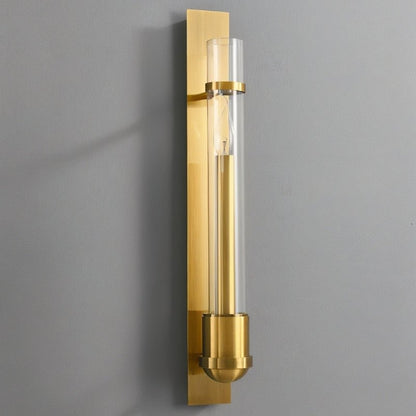 Modern brass wall lamp with glass shade by Residence Supply, designed for stylish indoor lighting.