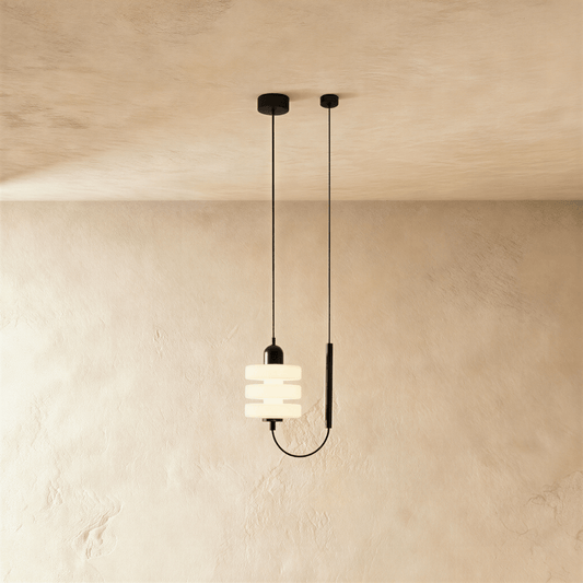 Nigal Pendant Light by Residence Supply hanging from ceiling with a modern design and metal fixture.