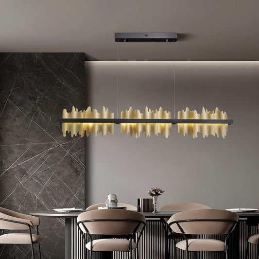 Modern Ninda Linear Chandelier by Residence Supply featuring sleek metal frame and multiple hanging light bulbs for contemporary decor.