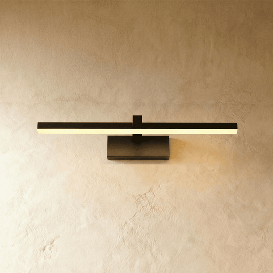Ninette Wall Lamp by Residence Supply featuring a sleek design with a white shade and modern metal arm for ambient lighting.