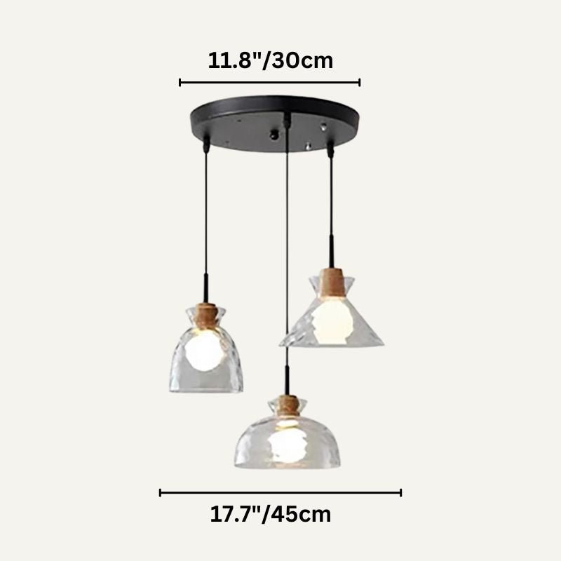 Nivkah Pendant Light by Residence Supply hanging with a sleek modern design, featuring a round metal shade and warm interior glow.