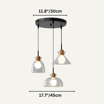 Nivkah Pendant Light by Residence Supply hanging with a sleek modern design, featuring a round metal shade and warm interior glow.