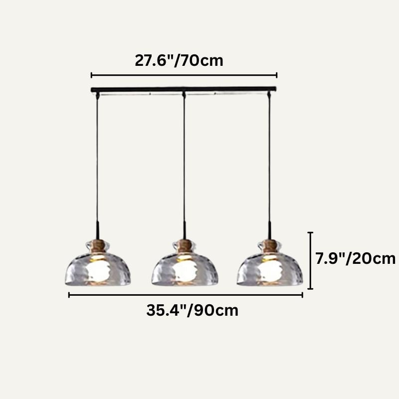 Nivkah Pendant Light by Residence Supply hanging from ceiling with a modern design and warm ambient lighting.