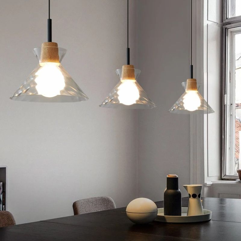 Nivkah Pendant Light by Residence Supply hanging from ceiling with a sleek modern design and warm ambient lighting.