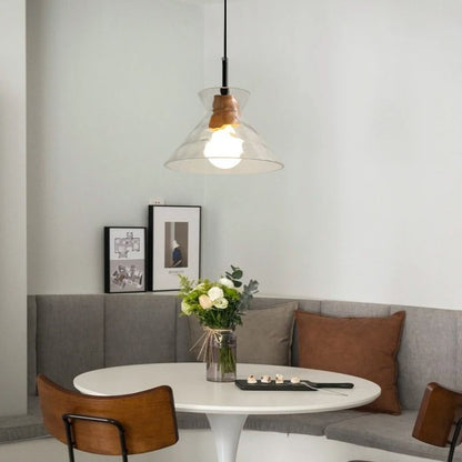 Nivkah Pendant Light by Residence Supply hanging from ceiling with a modern design and warm lighting.