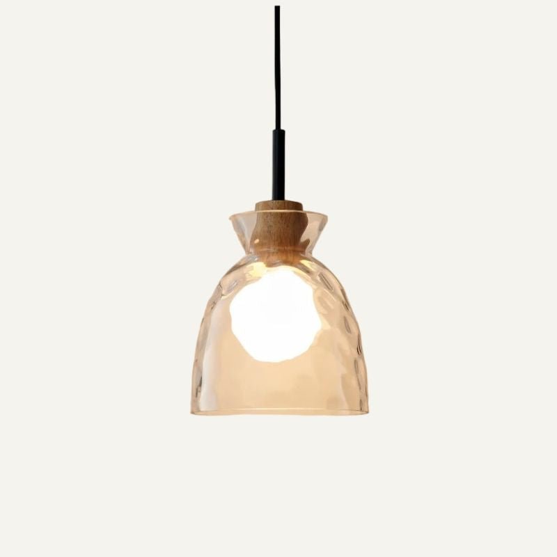 Nivkah pendant light by Residence Supply featuring a modern design with a sleek metal finish and clear glass shade.