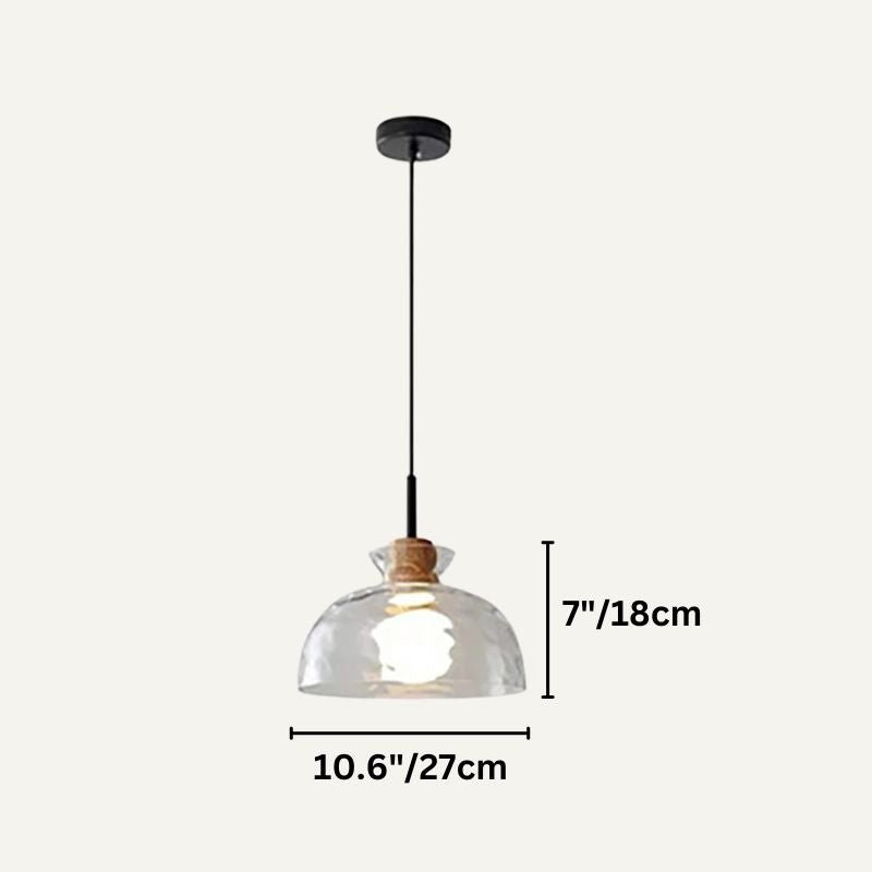 Nivkah Pendant Light by Residence Supply hanging from ceiling with modern design and warm lighting in a contemporary interior.
