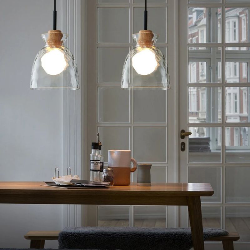 Nivkah pendant light by Residence Supply featuring a modern design with a sleek metal finish and a suspended glass shade.