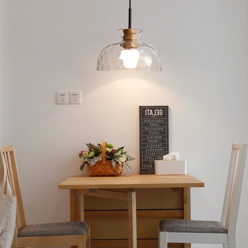 Nivkah pendant light with a modern design, featuring a sleek metal shade and hanging cord, perfect for contemporary interior decor.