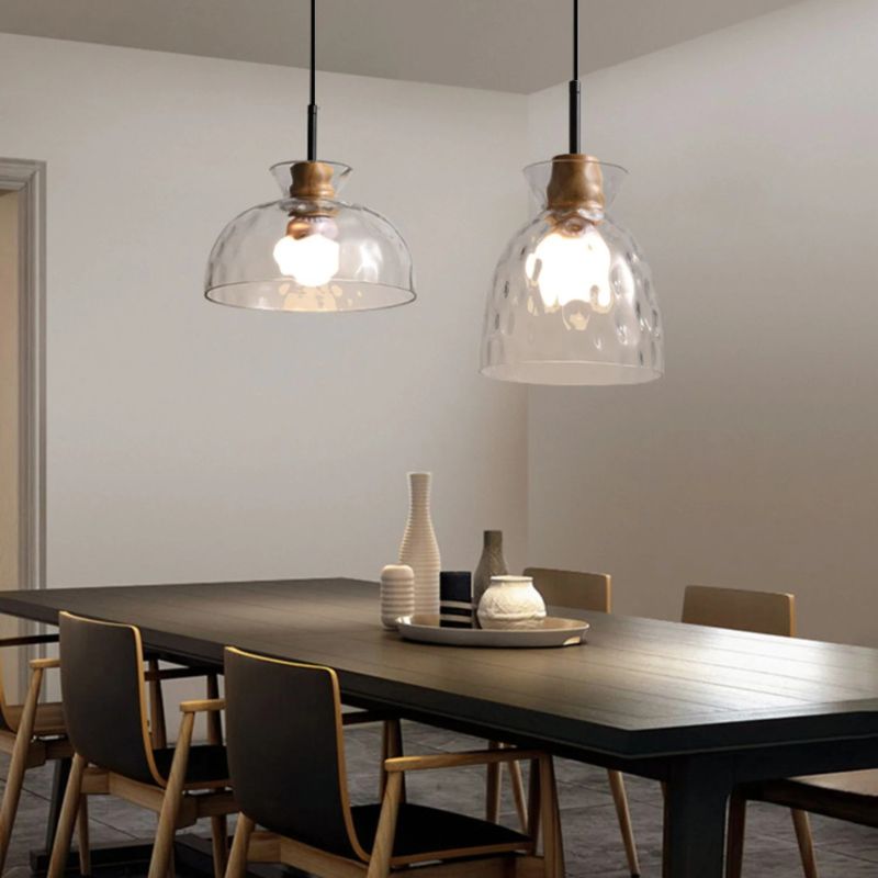 Nivkah Pendant Light by Residence Supply featuring a modern design with a sleek metal finish and clear glass shade.