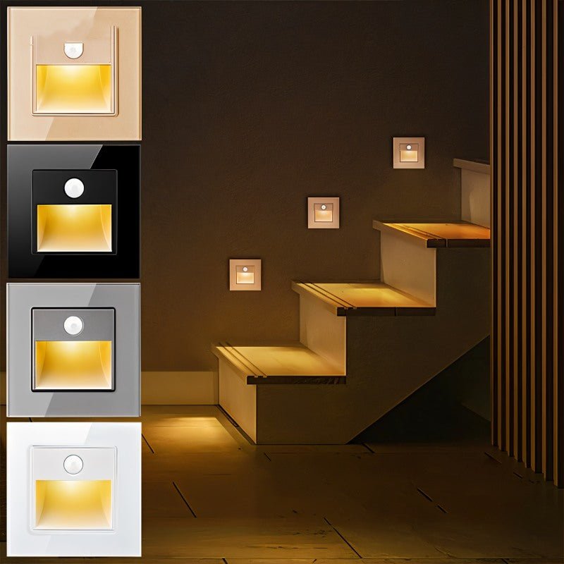Noa Stair Light by Residence Supply, sleek modern LED step light mounted on a staircase wall for illumination and safety.