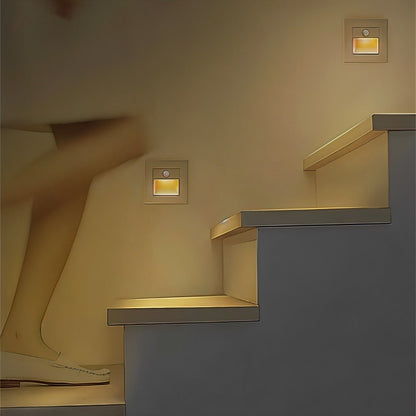 Noa Stair Light by Residence Supply illuminating a staircase with sleek, modern design and soft LED lighting.