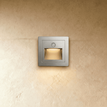 Noa Stair Light by Residence Supply, sleek LED step light mounted on staircase wall for ambient illumination.