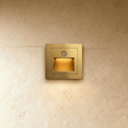 Noa Stair Light by Residence Supply mounted on a staircase wall, featuring a sleek modern design for subtle illumination