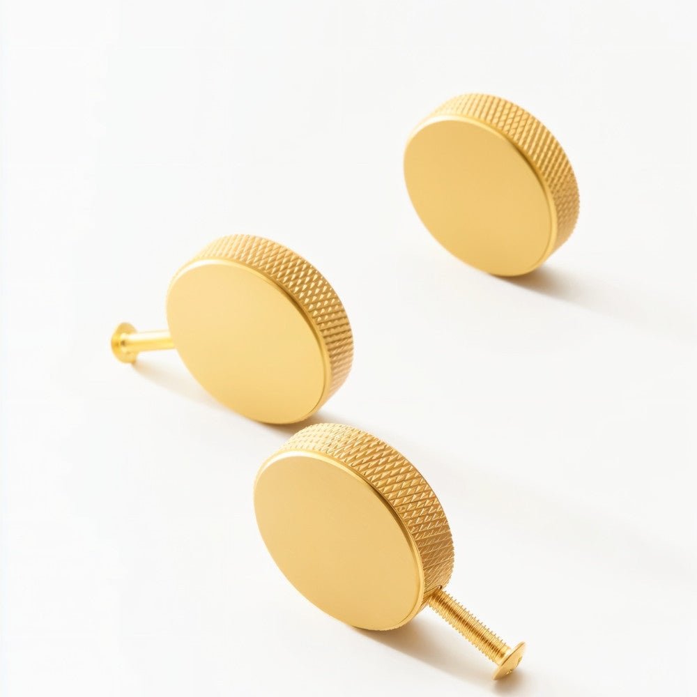 Set of cylindrical knurled Noah cabinet knobs by Residence Supply, perfect for enhancing kitchen or bathroom cabinetry.