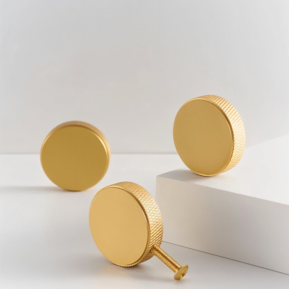 Cylindrical Noah knob with knurled modern design, made of metal, for cabinet hardware in home and garden decor.