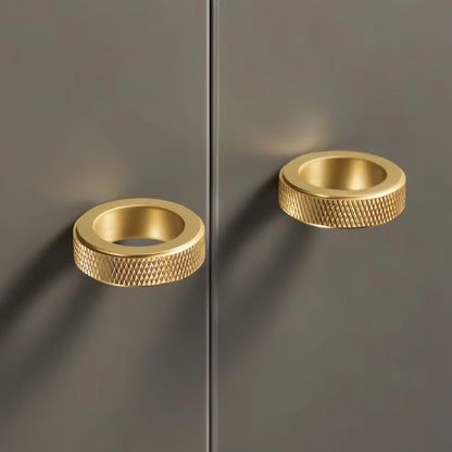 Gray cylindrical Noah knob with knurled texture, ideal for cabinet hardware in home and garden decor.