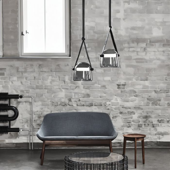 Modern Nola Pendant Light by Residence Supply hanging from a ceiling with a sleek, minimalist design and warm lighting.