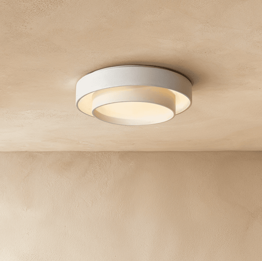 Modern Novis ceiling light by Residence Supply with a sleek, minimalist design and warm ambient lighting.