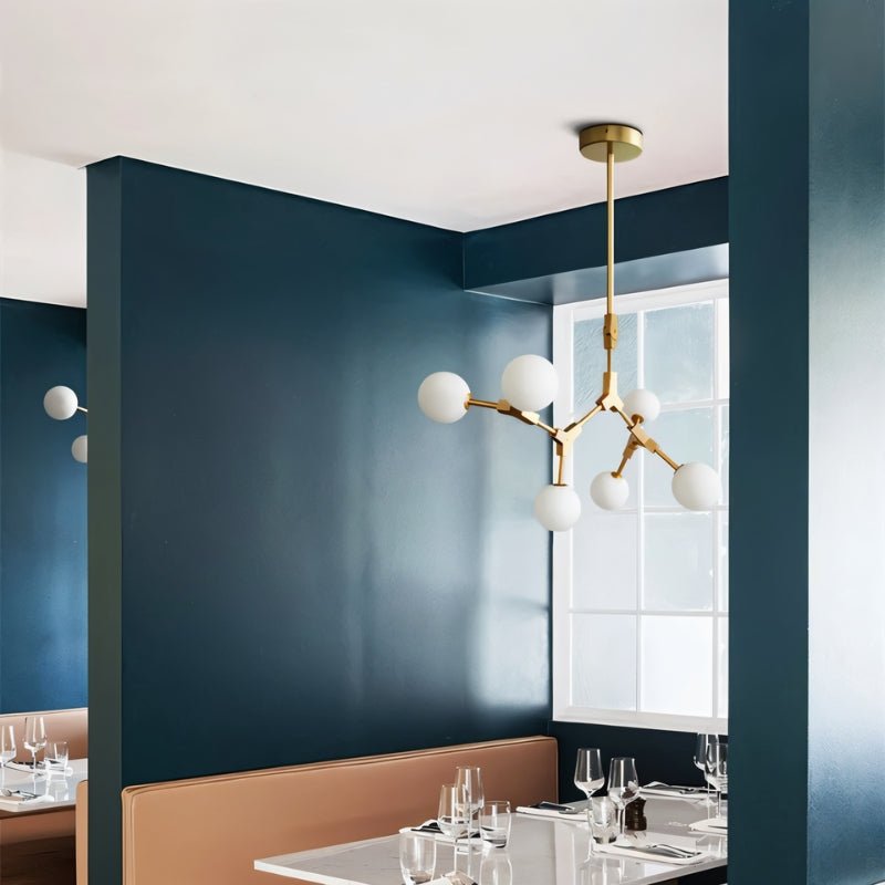 Elegant Noxira chandelier by Residence Supply featuring multiple glass globes and a modern metal frame for stylish lighting.