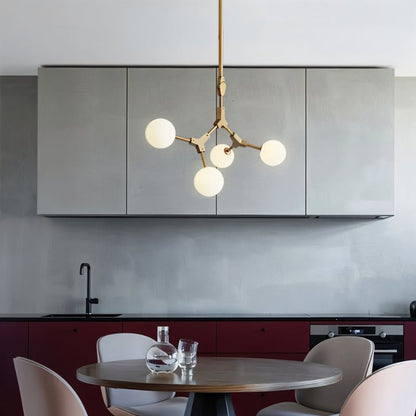 Elegant Noxira chandelier by Residence Supply featuring intricate metalwork and multiple light fixtures for a stylish lighting centerpiece.