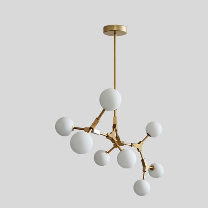 Elegant Residence Supply Noxira Chandelier with multiple glass globes and intricate metal frame, hanging from a ceiling.