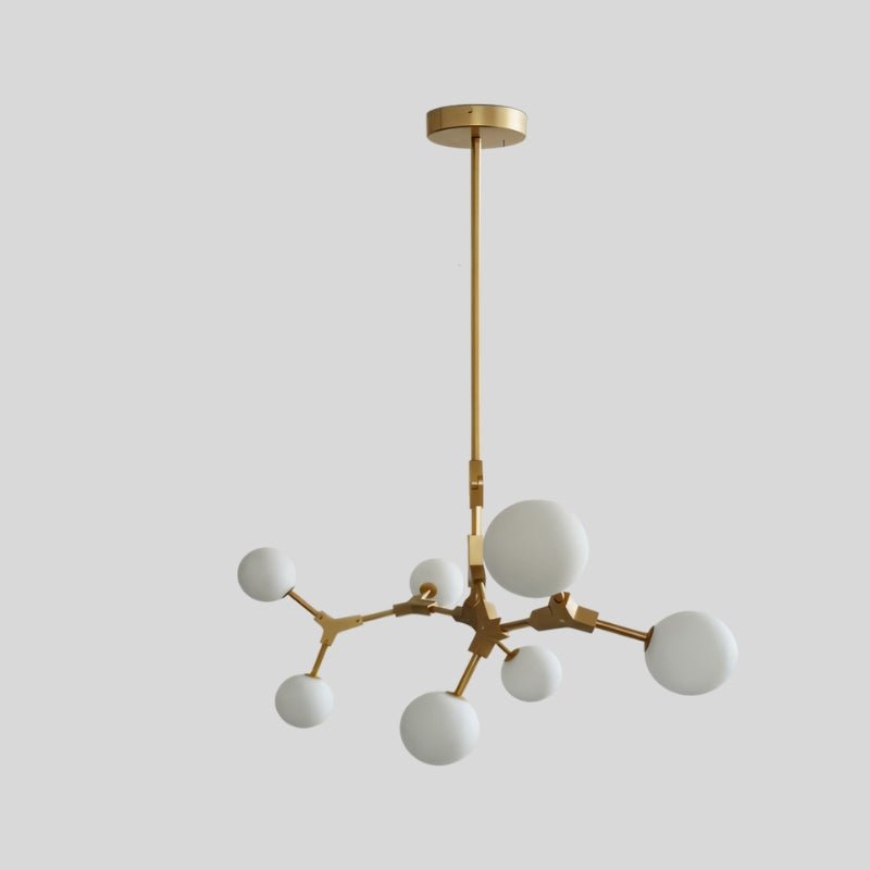 Elegant Noxira chandelier by Residence Supply featuring multiple hanging glass orbs and a sleek modern design.