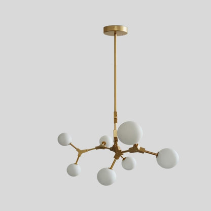 Elegant Noxira chandelier by Residence Supply featuring multiple hanging glass orbs and a sleek modern design.