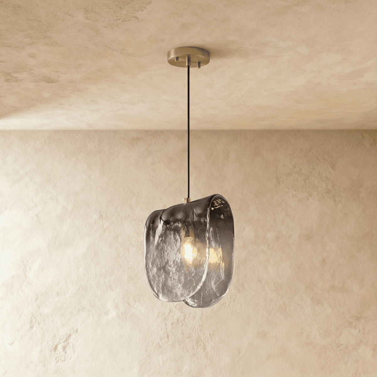 Nuppu Pendant Light by Residence Supply hanging from ceiling with a modern, minimalist design in a neutral color.