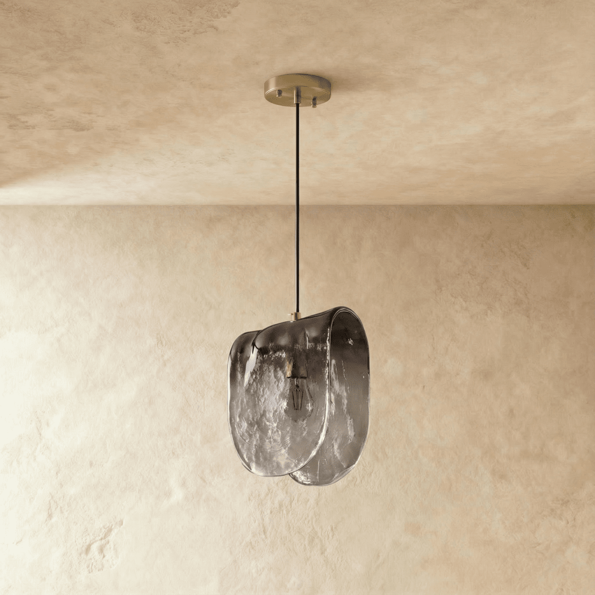 Residence Supply Nuppu Pendant Light hanging with a sleek, modern design and warm wooden finish.
