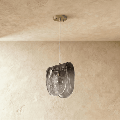 Residence Supply Nuppu Pendant Light hanging with a sleek, modern design and warm wooden finish.