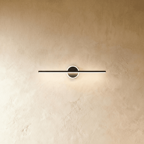 Nyxtra Wall Lamp by Residence Supply mounted on a wall with a modern design, featuring a sleek metal finish and ambient lighting.